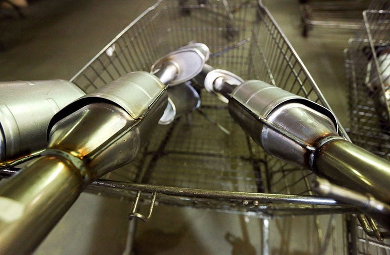 A shopping cart filled with catalytic converters