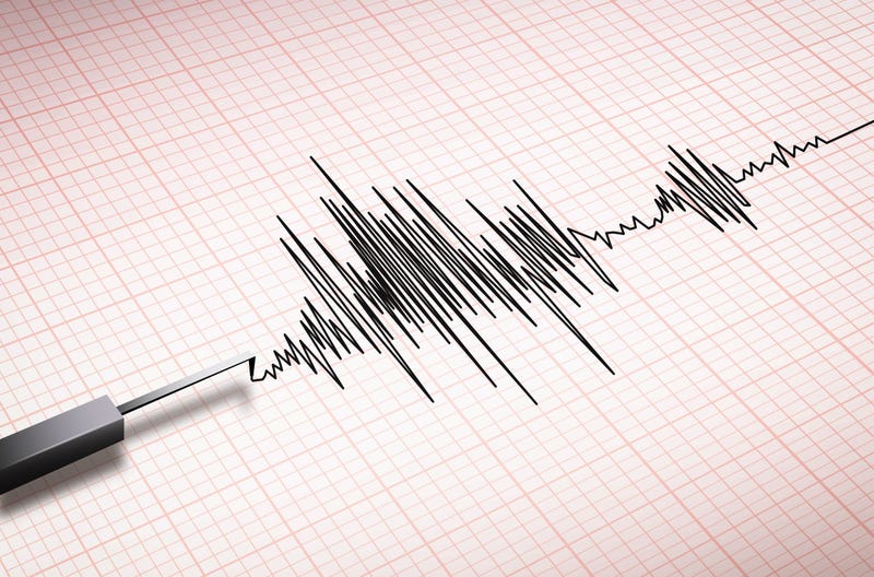 Closeup of a seismograph machine measuring an earthquake