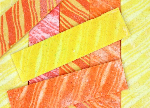 Strips of colorful, striped chewing gum