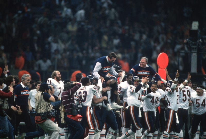 Head Coach Mike Ditka of the Chicago Bears gets carried off