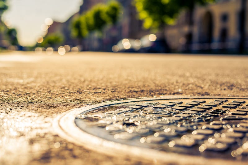 A large metal plate covering a man hole was reportedly sent sailing through the air after an underground explosion rattled a street in Highland Park Friday evening.