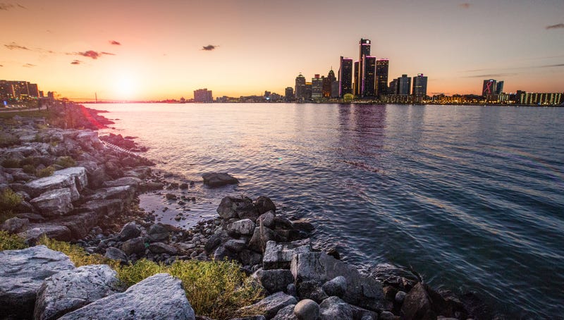 Sunset over Detroit skyline and river 