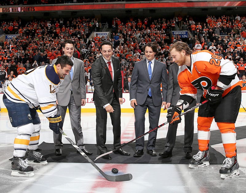 Former Philadelphia Flyer Danny Briere along with his sons Caelan Briere,Carson Briere and Cameron Briere drop the puck in a ceremony with Buffalo Sabres captain Brian Gionta #12 and Flyers captain Claude Giroux #28 before the game on October 27, 2015 at the Wells Fargo Center in Philadelphia, Pennsylvania. (Photo by Elsa/Getty Images)