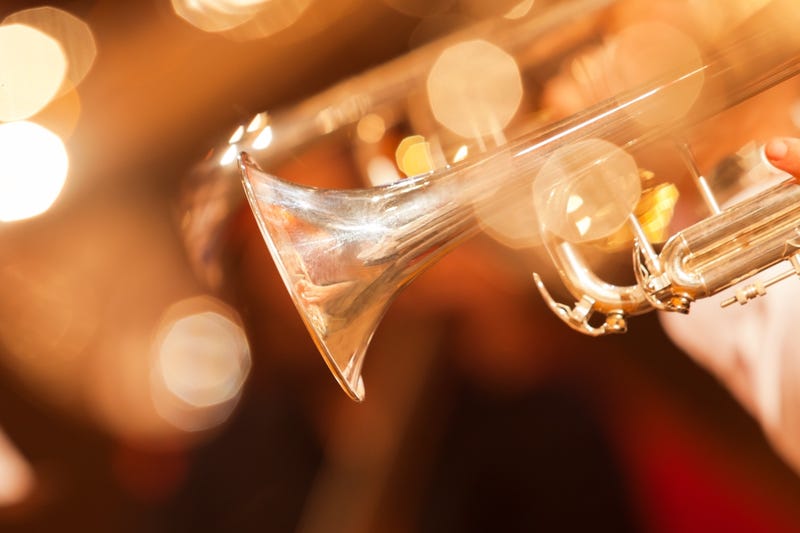 A trumpet sparkles in the light