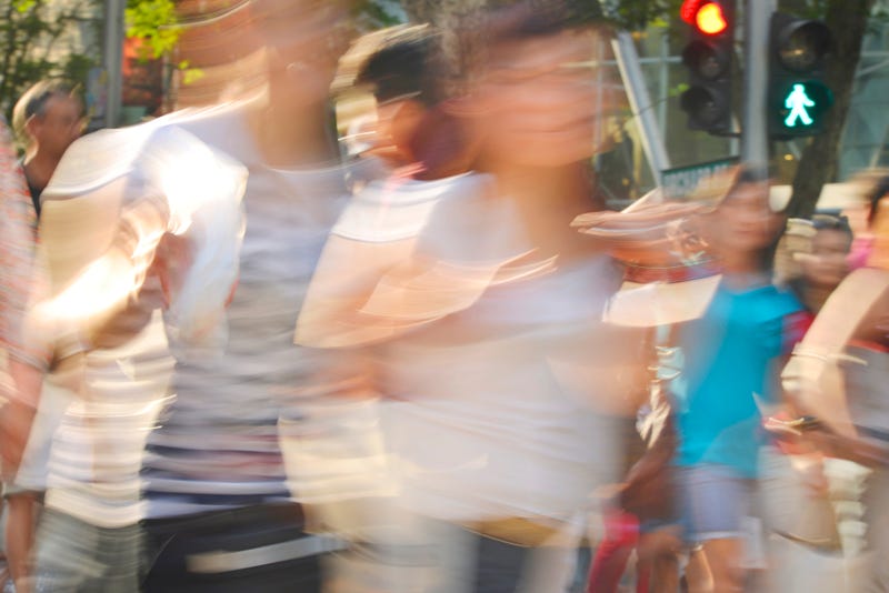 blurred images of people on street