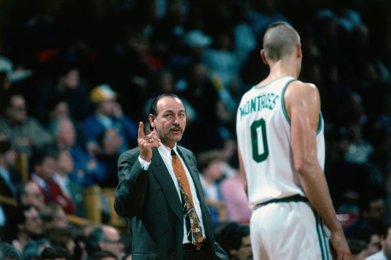 Head coach Chris Ford speaks to Eric Montross, #0 of the Boston Celtics, during a game played in 1995 at the Boston Garden in Boston, Massachusetts.