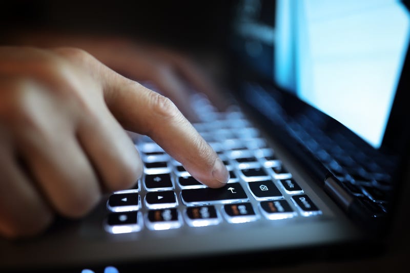 Stock image of person using laptop
