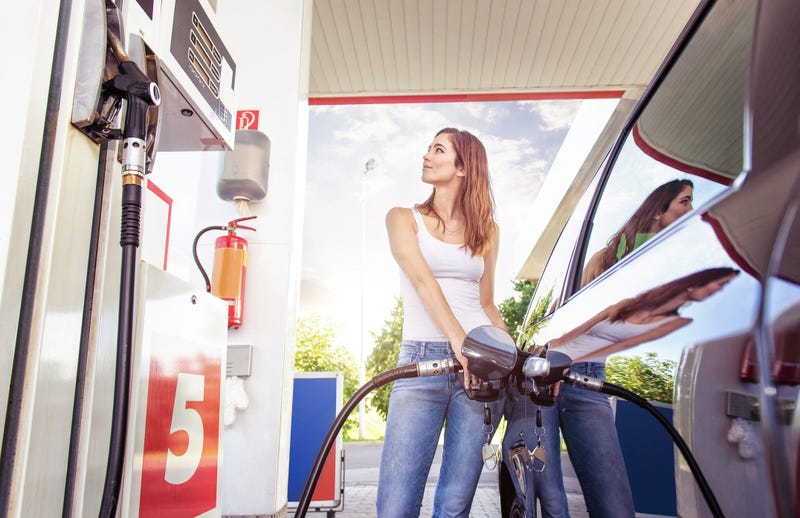 Woman at gas pump