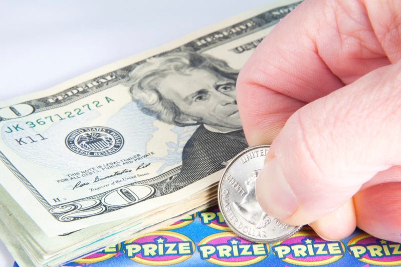 Stock photo of scratch-off lottery ticket and money