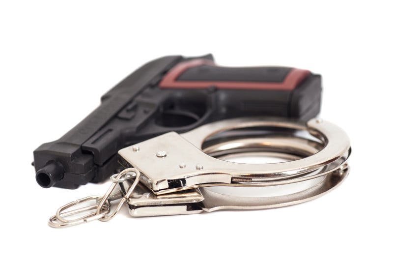 gun/handcuffs