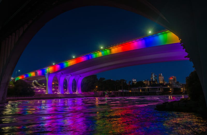 I35W bridge over Mississippi lit in rainbow on Pride weekend.