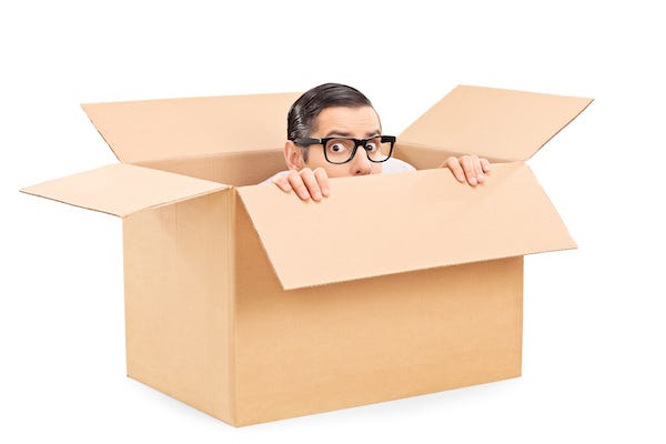 Man hiding in a cardboard box