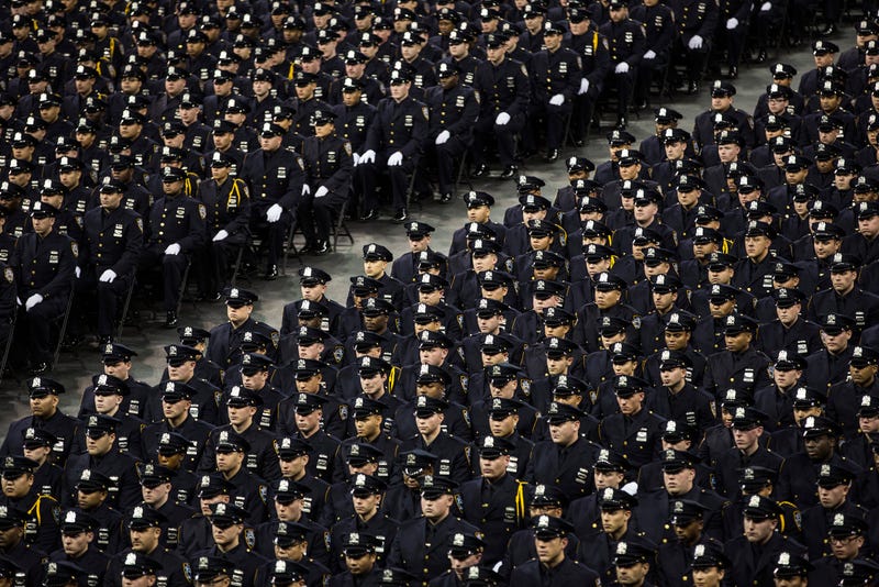 New police recruits attend an NYPD graduation ceremony.