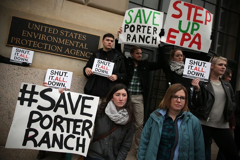 protesters stand outside the EPA building