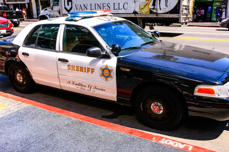 sheriff patrol car parked at curb