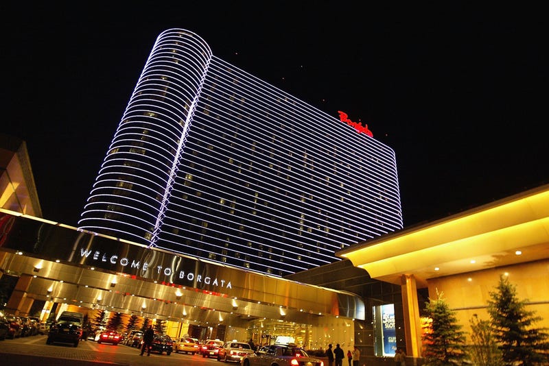Visitors enter the Borgata Hotel and Casino May 8, 2004 in Atlantic City, New Jersey. Trump Hotels & Casino Resorts, Inc., which is $1.8 billion in debt, posted a first quarter loss on April 30, 2004 of $48 million, double its losses for the same quarter a year ago.