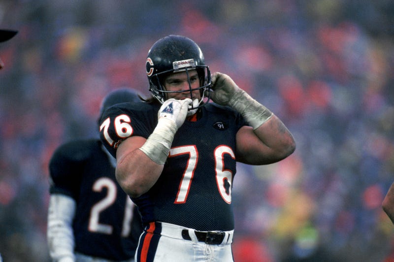 Steve McMichael, of the Chicago Bears, removes his helmet during the game against the Kansas City Chiefs on Dec. 30, 1990, in Chicago.