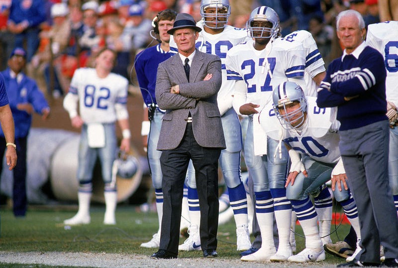 Head coach Tom Landry of the Dallas Cowboys watches from the sideline during a game in the 1988 season.