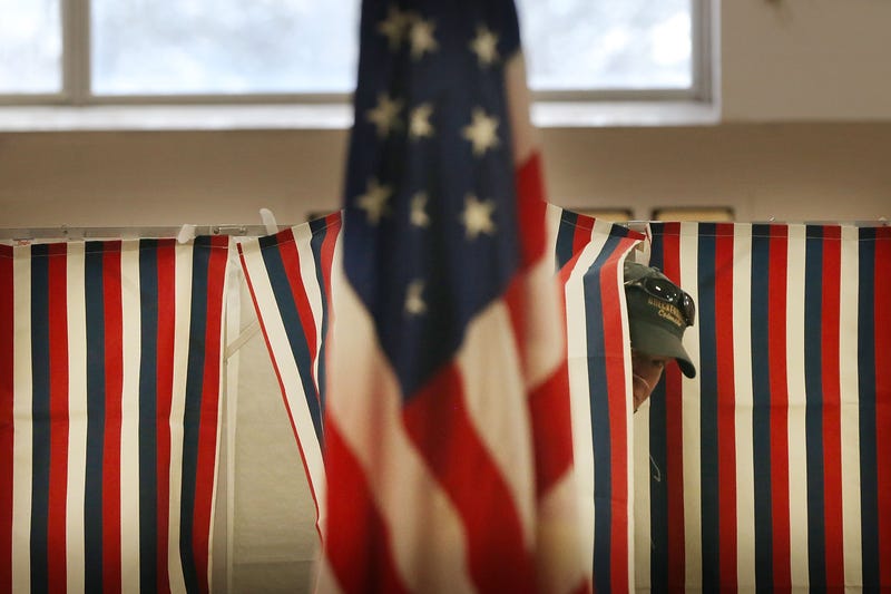 A man exits a voting booth inside of a middle school serving as a voting station on the day of the New Hampshire Primary on February 9, 2016 in Bow, New Hampshire.