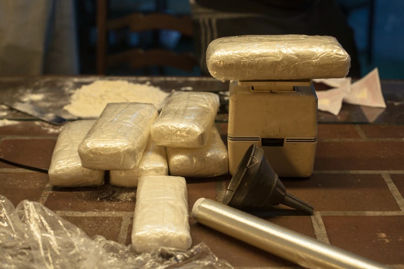FILE: Cocaine weighed into kilogram packets.