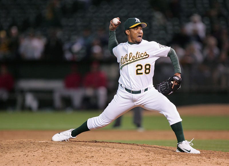 itcher Octavio Dotel #28 of the Oakland Athletics delivers against the Anaheim Angels during the game at the Associates Coliseum on June 29, 2004 in Oakland, California.