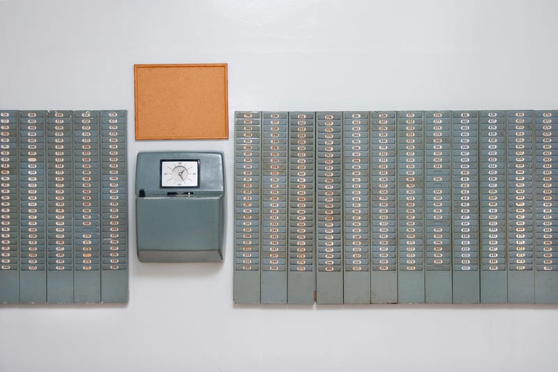Workers used to more commonly punch in and out of the work day using a setup like this