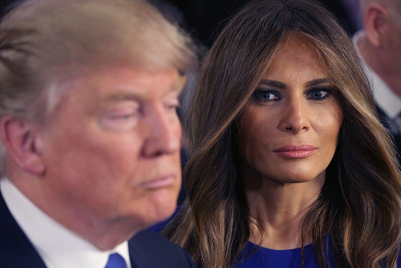 Republican presidential candidate Donald Trump and his wife Melania greet reporters in the spin room following a debate sponsored by Fox News at the Fox Theatre on March 3, 2016 in Detroit, Michigan. Voters in Michigan will go to the polls March 8 for the State's primary. (Photo by Chip Somodevilla/Getty Images)