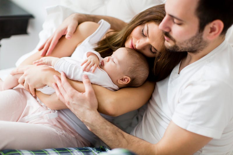 Parents with newborn stock photo. 