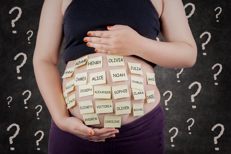 Pregnant belly with sticky notes on it