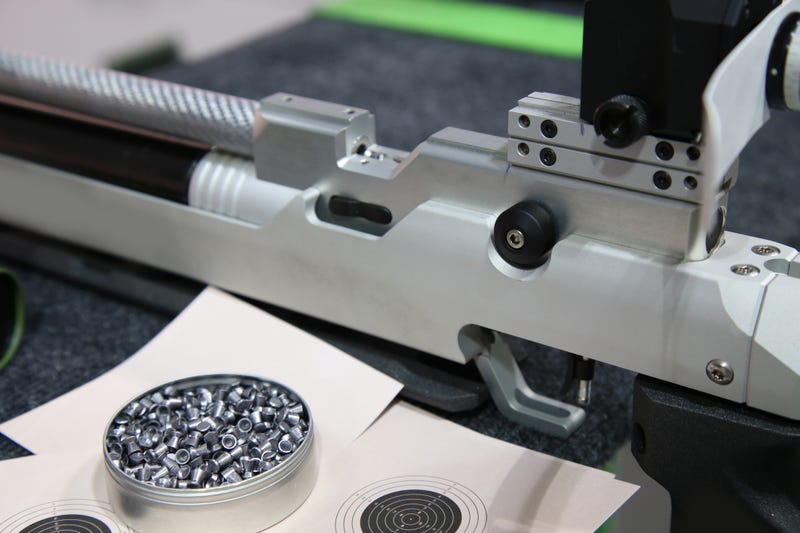 FILE: Aluminum can of lead pellets for air rifle and air rifle.