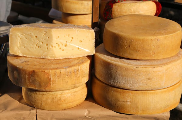 Stacked wheels of cheese
