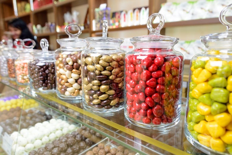Candies in glass jars in a candy shop