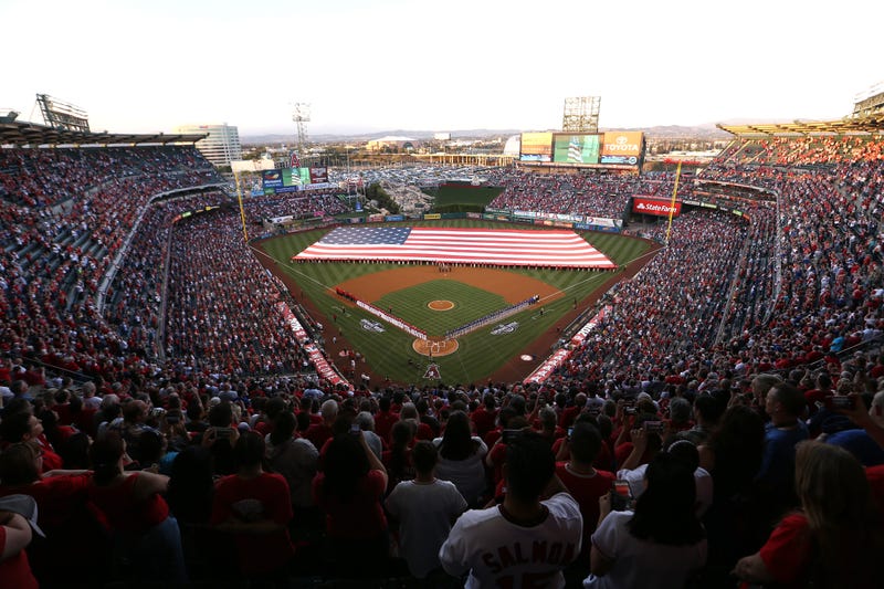 Players line the field during pre-game festivities on Opening Day before a baseball game between the Los Angeles Angels and Chicago Cubs at Angel Stadium of Anaheim on April 4, 2016 in Anaheim, California.