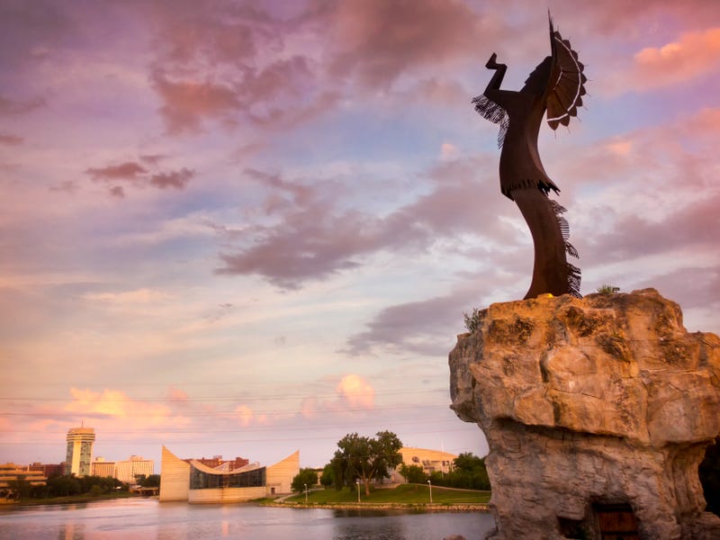 Beautiful sunset with the Keeper of the Plains in Wichita, Kansas