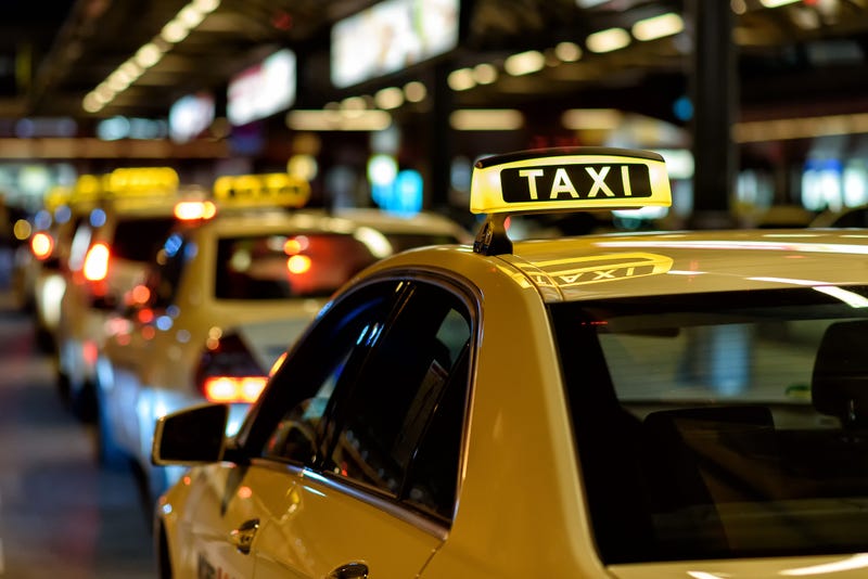File photo of taxi cabs waiting to pick up passengers.