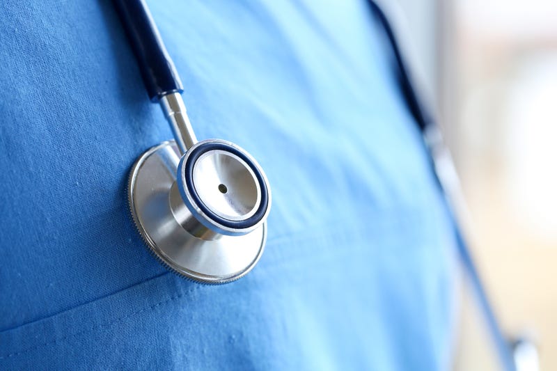 Closeup of a doctor and their stethoscope.