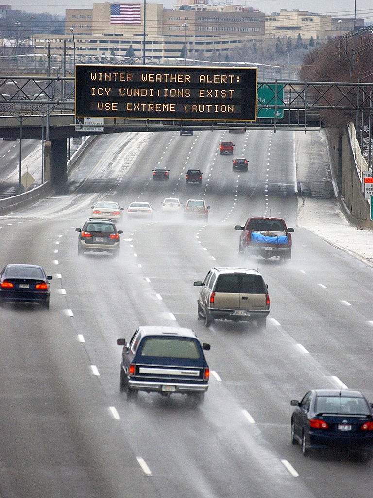 ATLANTA - JANUARY 29: A highway informational sign advises motorists to the dangerous driving conditions along Interstate 75-85 January 29, 2005 in downtown Atlanta, Georgia. Metro Atlanta and north Georgia awoke to treacherous roads, canceled activities and flights. At least three traffic deaths have been attributed to the icy conditions. (Photo by Erik S. Lesser/Getty Images)