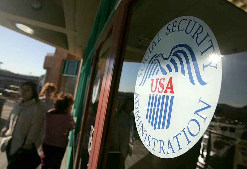 People line up outside of the Social Security Administration office.