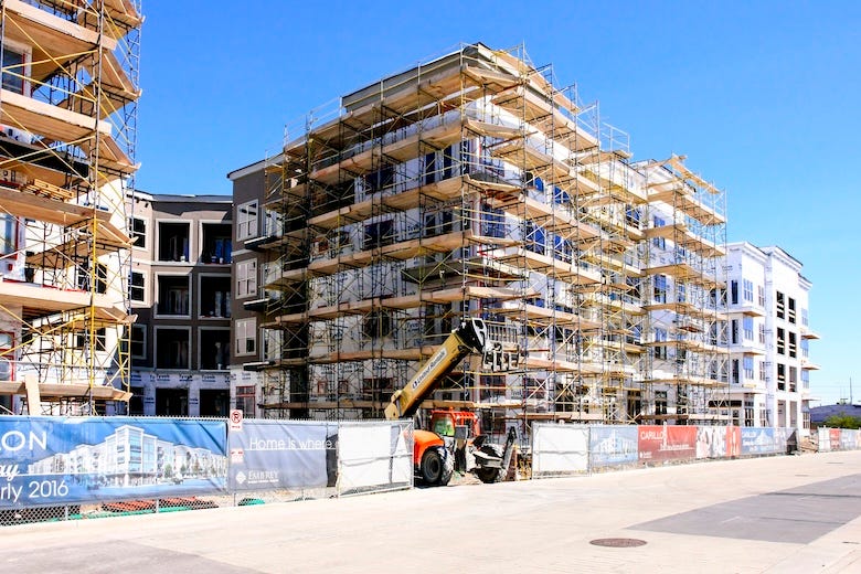 Scaffolding around an apartment complex under construction