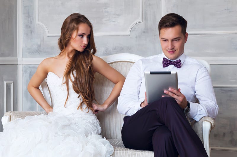 Wedding couple with tablet