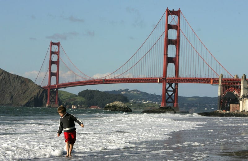  A boy plays in the water at Baker Beach near the Golden Gate Bridge March 25, 2005 in San Francisco, California.