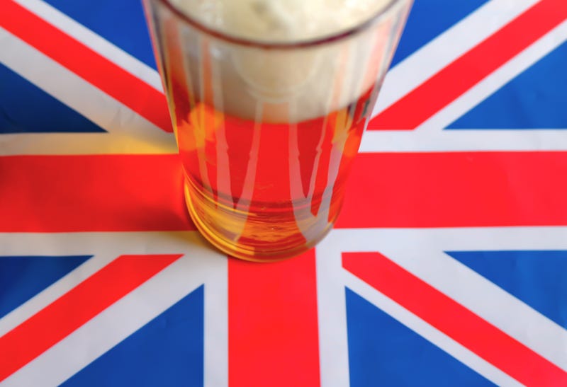 A pint of beer on a Union Jack flag. 