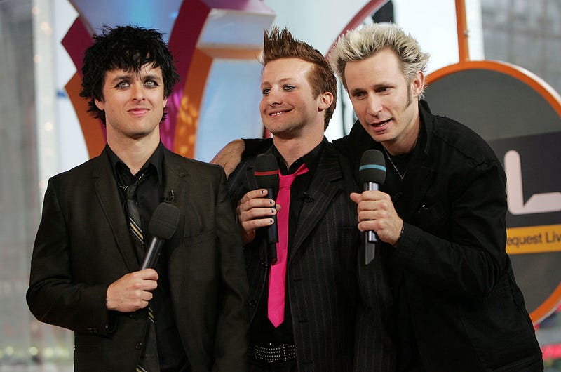 Billie Joe Armstrong, Tre Cool, and Mike Dirnt of Green Day appear onstage during MTV's Total Request Live at the MTV Times Square Studios April 7, 2005 in New York City.
