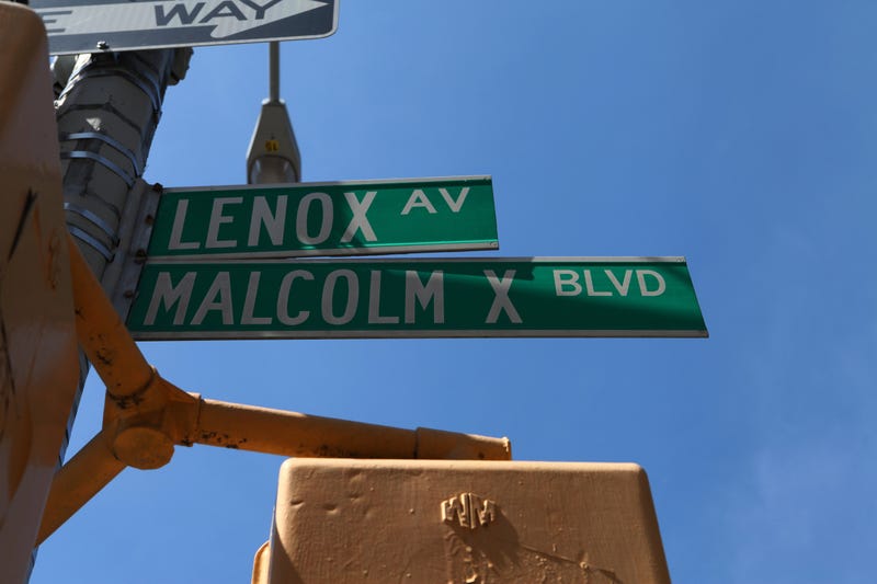 Lenox Avenue - Malcolm X Boulevard street signs in Harlem, New York.
