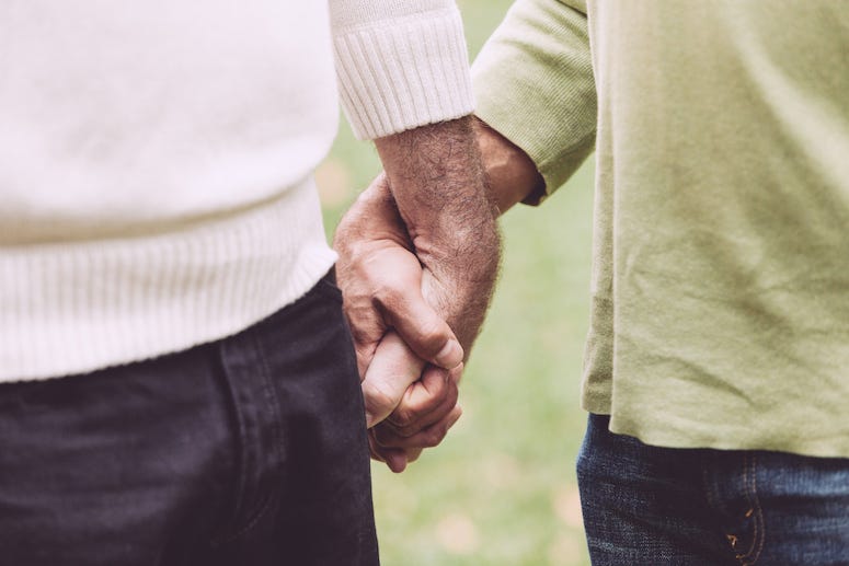 Elderly People Holding Hands