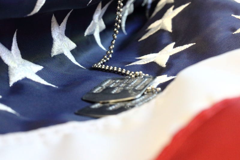 dog tags on U.S. flag