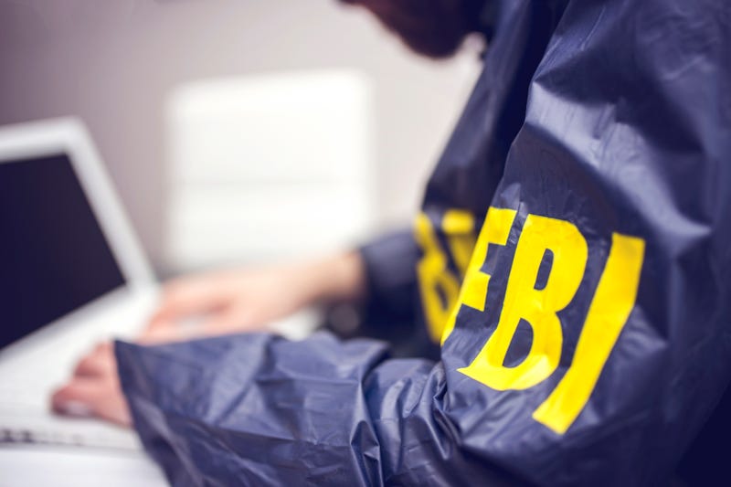 FBI agent searching laptop
