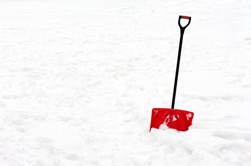 Red shovel in snow