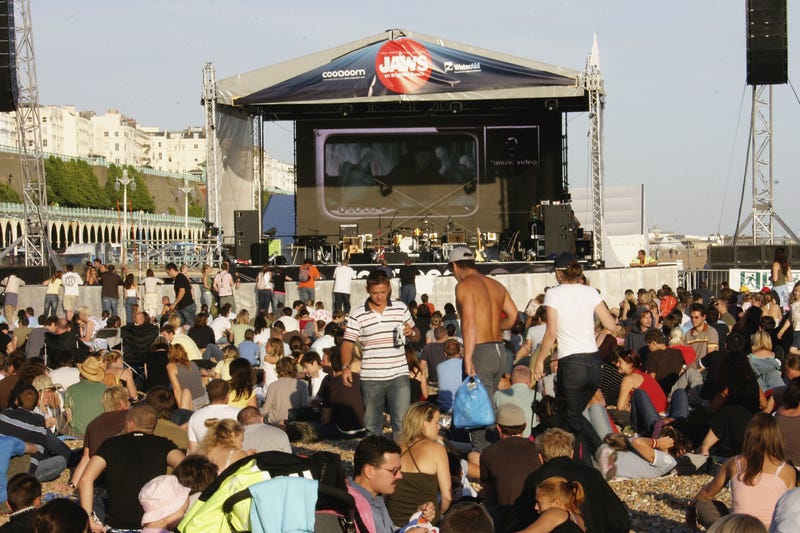 Beachgoers in Brighton, England soak up the weekend sun at a 2005 party to celebrate the 30th anniversary of 'Jaws,' complete with outdoor screening.