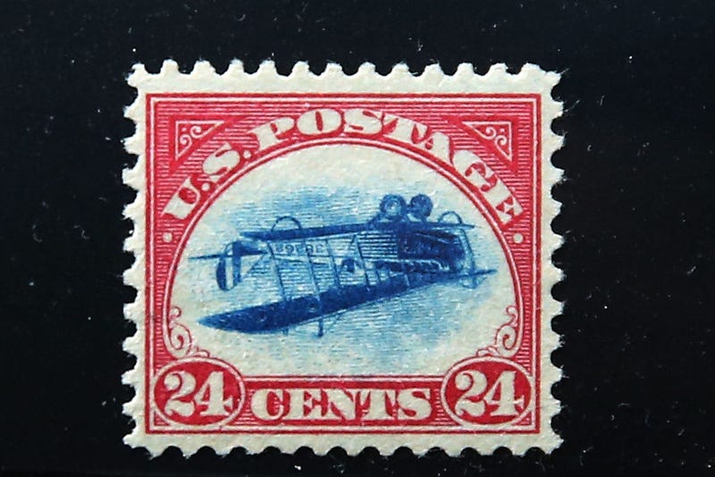 A rare stamp known as an "Inverted Jenny" is displayed at the World Stamp Show in Manhattan on June 2, 2016 in New York City. 